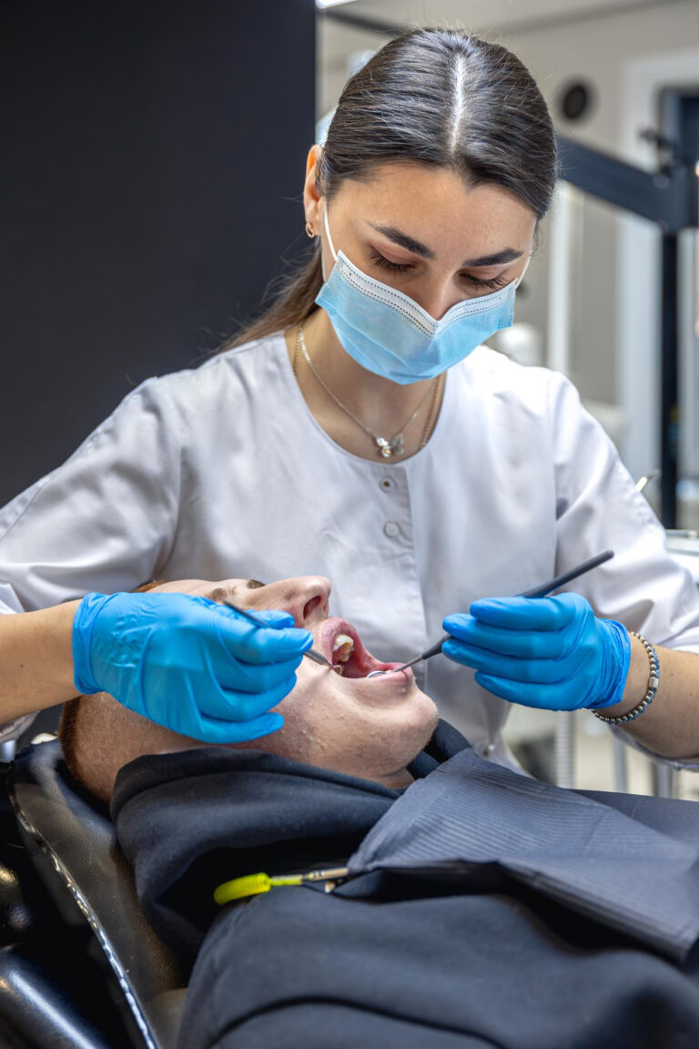 Single dental implant treatment being performed by a dentist for tooth replacement in Los Algodones, Mexico